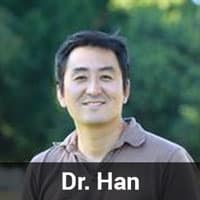A person standing outdoors with a blurred background of greenery, embodying the serene and compassionate spirit of a veterinarian. The text "Dr. Han" is overlaid at the bottom of the image.